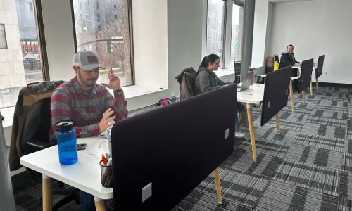 KBL employees working at their desks in their new open workspace at 59 Court Street in Binghamton, NY.